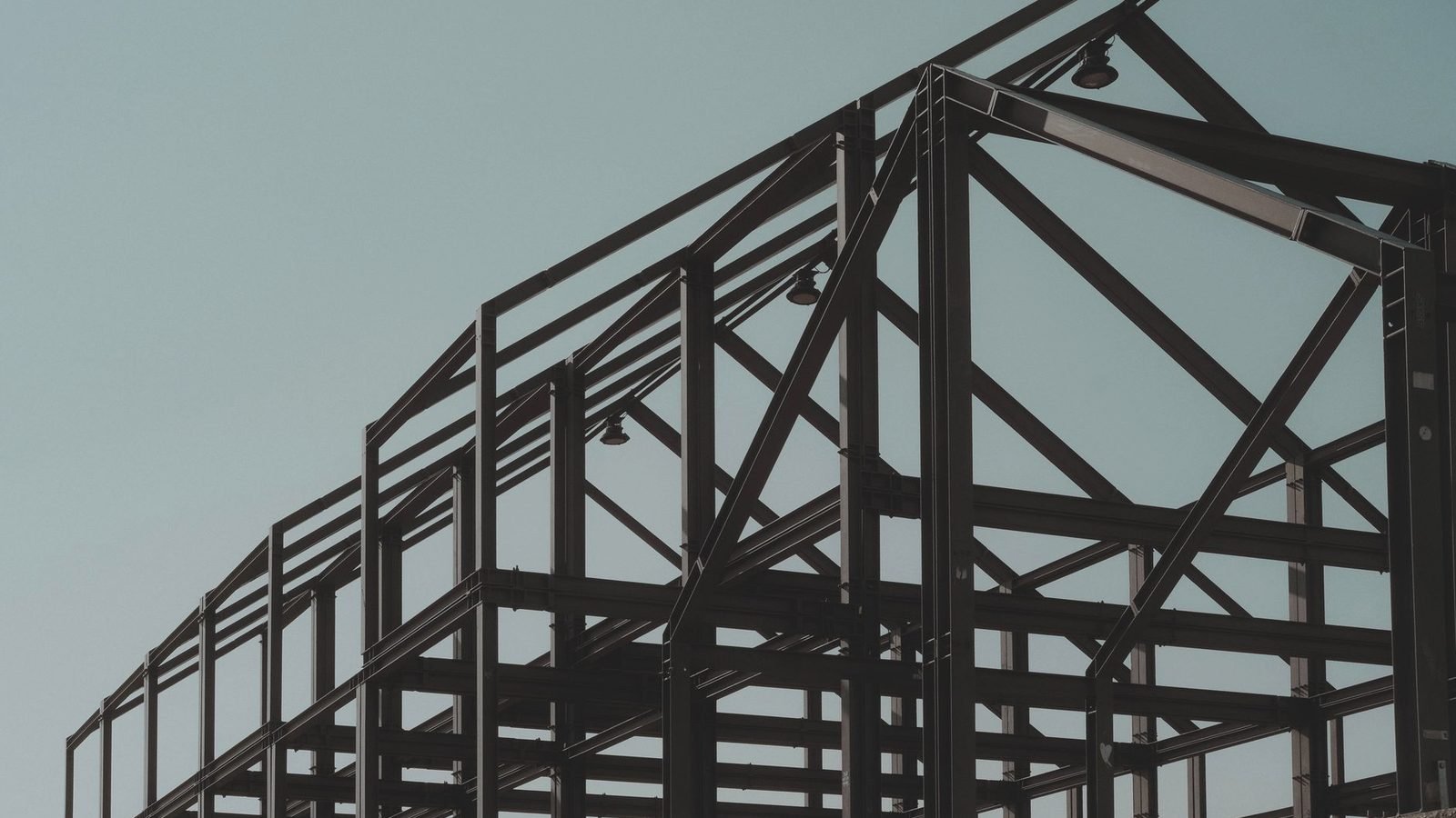 Industrial media blasting of structural steel inside a Northwest Arkansas facility