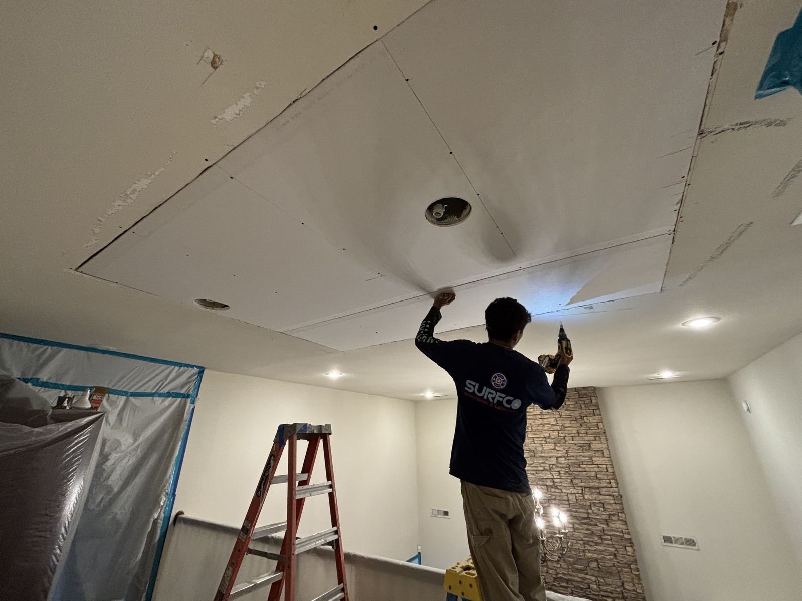 Ceiling drywall replaced after a water loss by Surfco in Northwest Arkansas