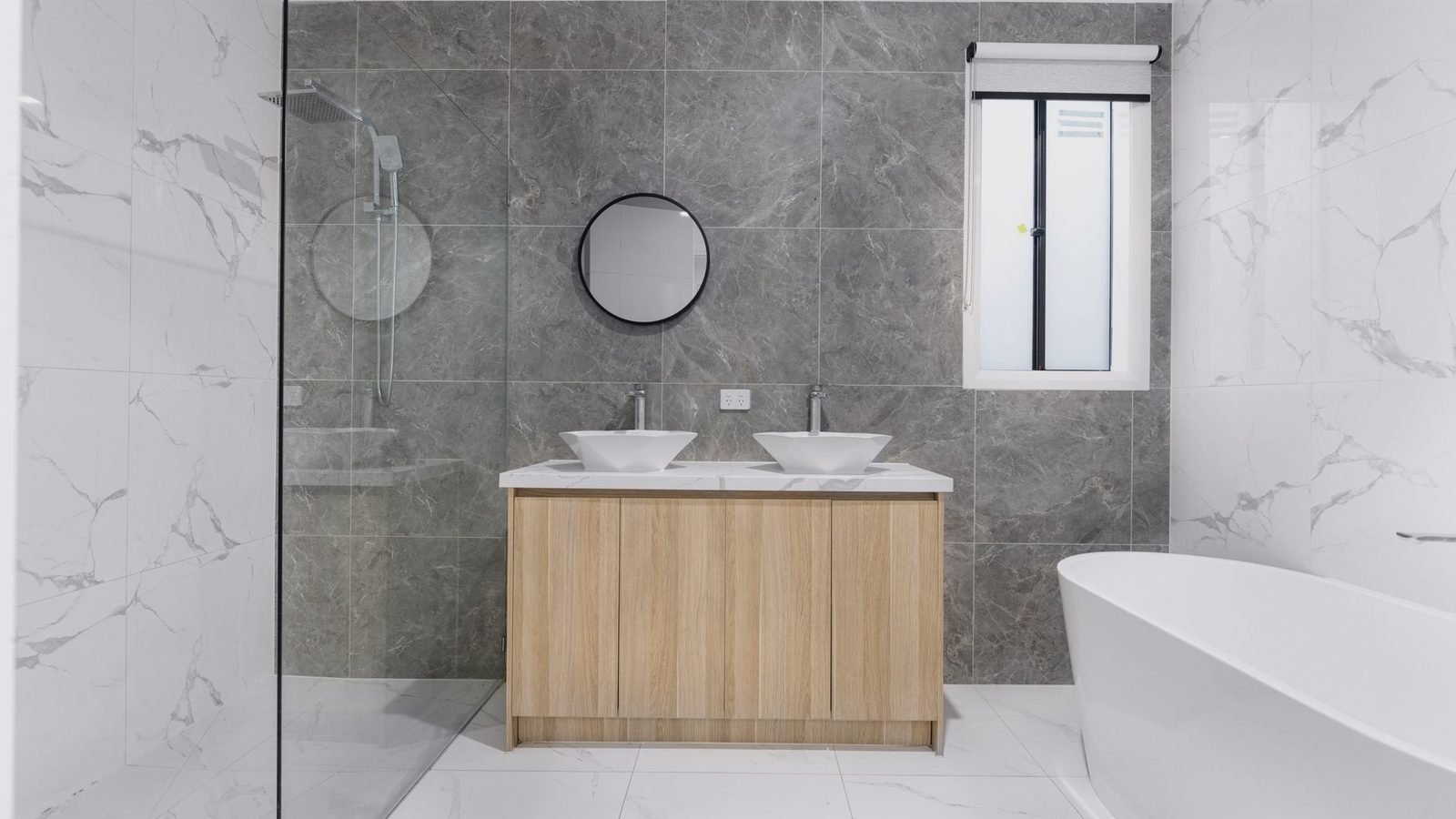 Remodeled bathroom with a tiled walk-in shower in a Northwest Arkansas home